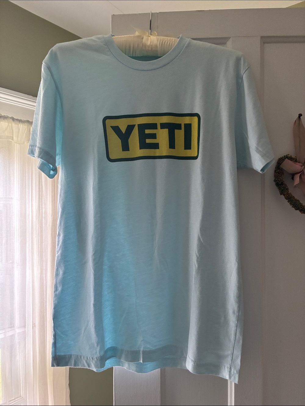 Yeti Light Blue Short Sleeve Tee with Yellow Logo